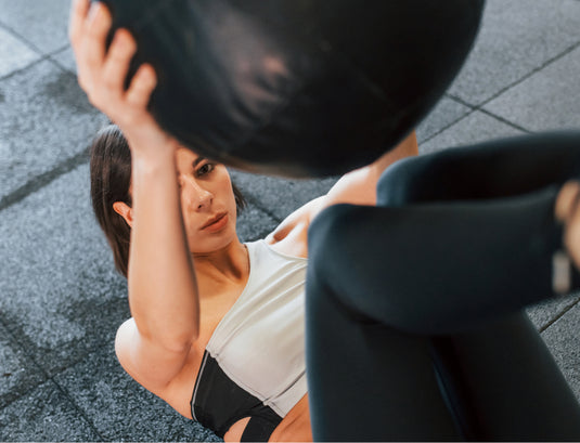 A woman carries her clothes. But the shoe carries the woman